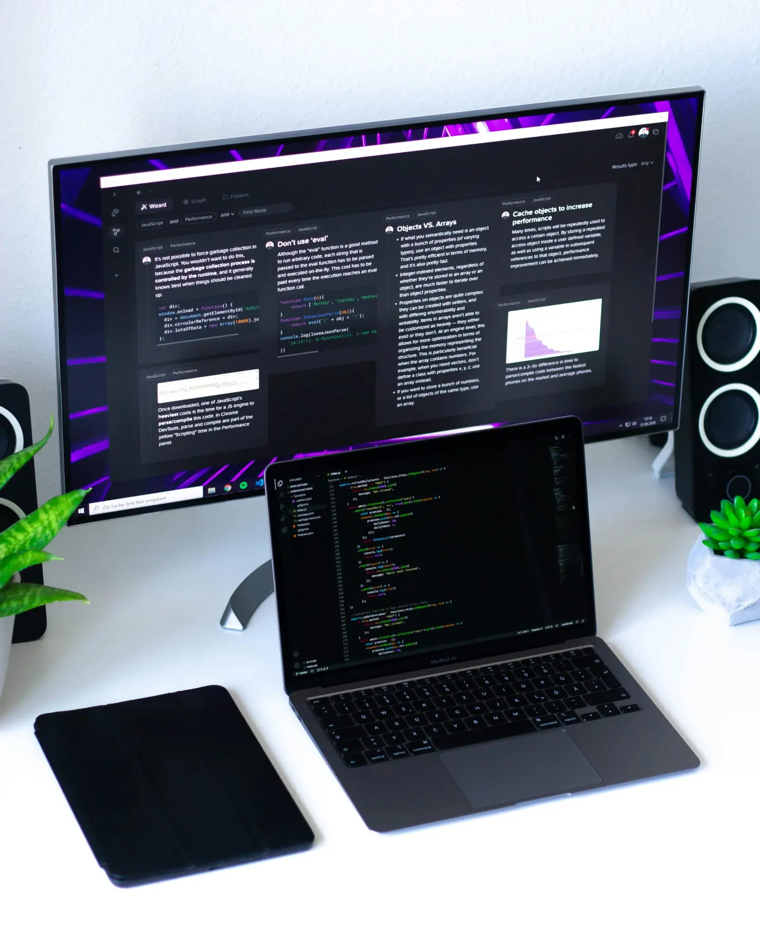 a laptop and a computer on a desk